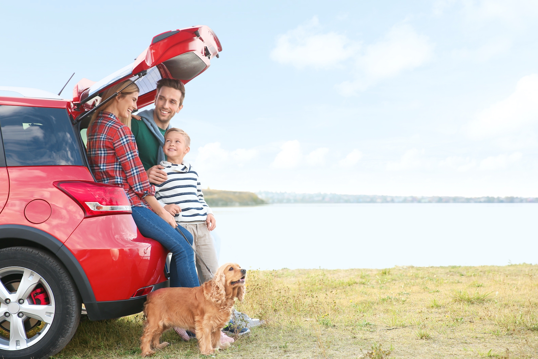 Family in Car with Dog